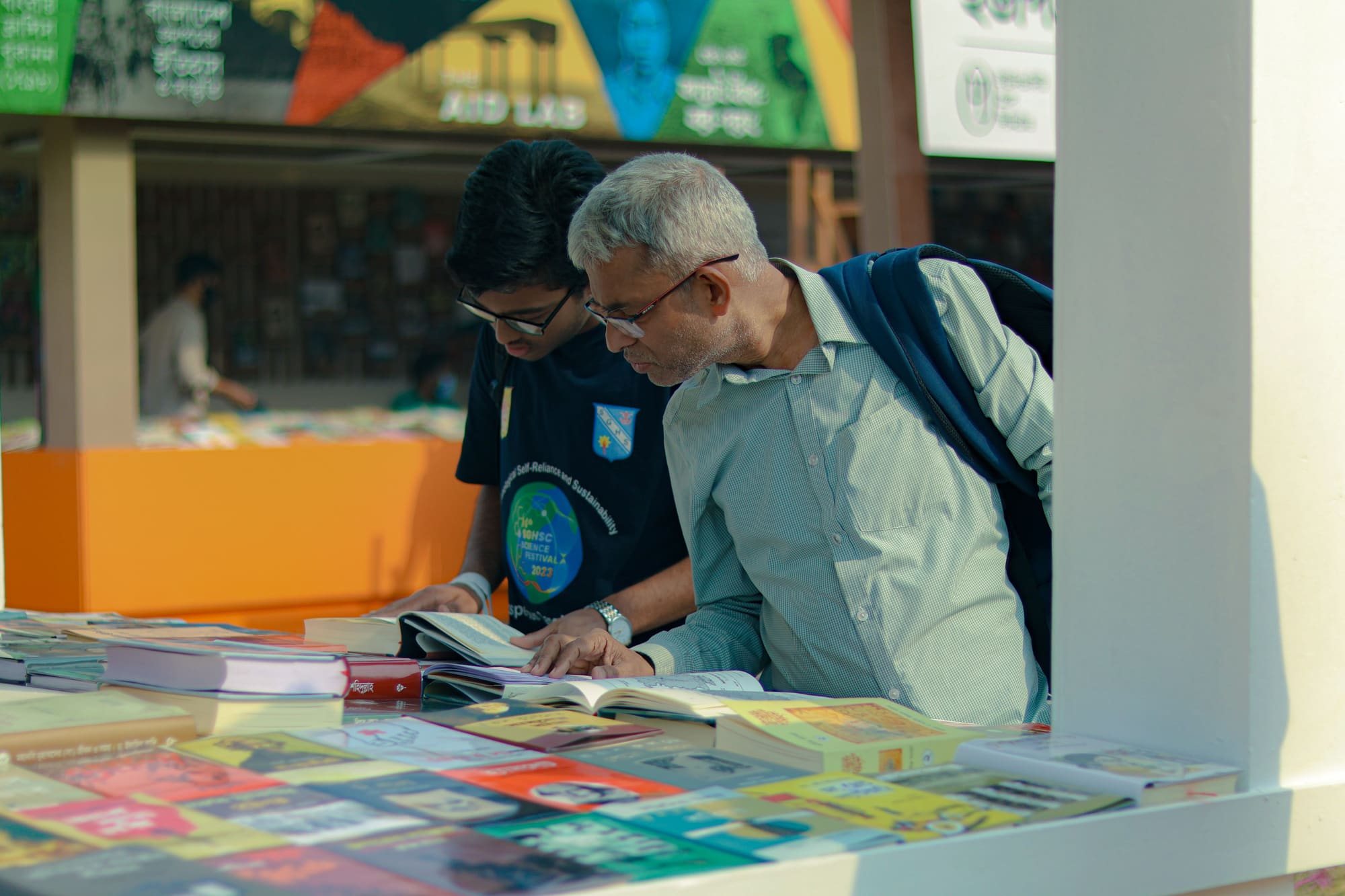 Readers browsing books together at a Words & Wild gathering